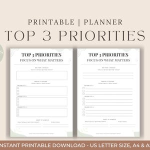 May include: Two printable planner pages with the text "Top 3 Priorities" and "Focus on What Matters." The pages have sections for daily tasks and priorities. The design is minimalist with a neutral colour palette and decorative elements.