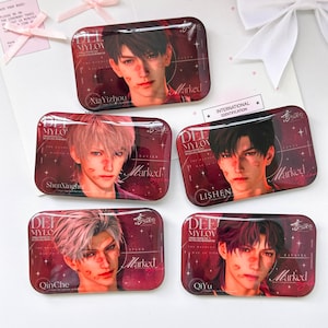 May include: Five rectangular metal tins featuring anime-style character portraits with red lipstick kiss marks on their faces. Each tin displays the text "DEEP MY LOVE," "Marked," and specific character names including XiaYizhou, ShenXinghui, Lishen, QinChe, and QiYu.