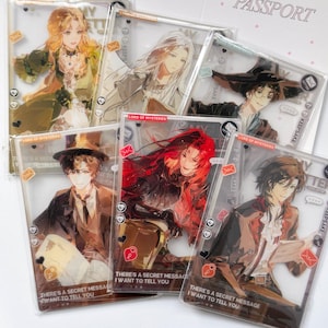 May include: A collection of six rectangular clear acrylic cards featuring anime-style character illustrations. Each card displays text including "LORD OF MYSTERIES" and "THERE'S A SECRET MESSAGE I WANT TO TELL YOU" alongside various small icons like envelopes and hearts.