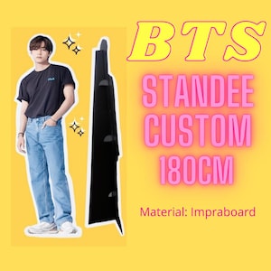 May include: A custom BTS standee, approximately 180cm tall, featuring a person in a black shirt and blue jeans. The standee is black and has the text "BTS STANDDEE CUSTOM 180CM" in pink and yellow. The material is Impraboard.