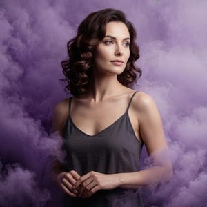 May include: A woman with brown curly hair wearing a dark grey camisole top, surrounded by purple smoke. She is looking off to the side with a thoughtful expression. The image has a soft, ethereal quality.