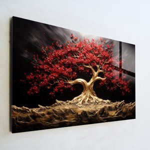 May include: A vibrant artwork featuring a stylized tree with a golden trunk and roots, and a canopy of red leaves. The tree is set against a dark, textured background, creating a striking contrast. The artwork is mounted on a glossy surface.