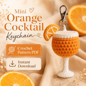 May include: A crochet orange cocktail keychain featuring a white stem and base, an orange bowl, and a small orange slice garnish. The text reads Mini Orange Cocktail Keychain, Crochet Pattern PDF, and Instant Download with a download icon.