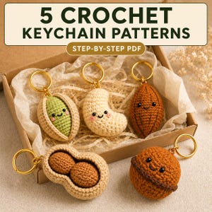 May include: Five crochet keychain patterns in a PDF format, featuring five small, stuffed, yarn-based nut and seed characters with smiling faces, including a pistachio, cashew, almond, peanut, and walnut, each attached to a gold-toned metal ring.