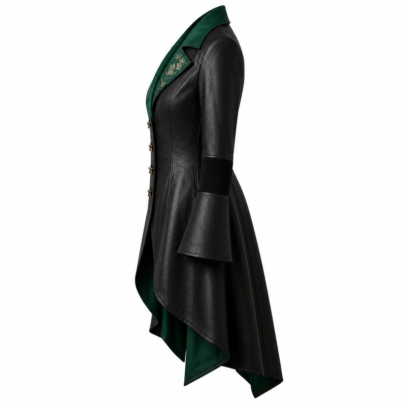 May include: A black long-sleeved coat with a high-low hemline, featuring a dark green lapel with floral embroidery. The coat has a row of small gold buttons along the front closure, flared cuffs, and a solid black exterior with a green interior lining.