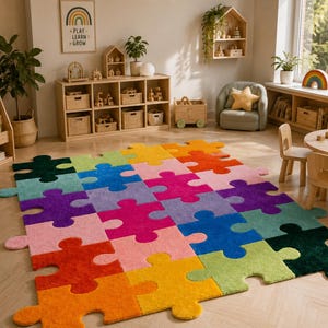 May include: A large rectangular area rug featuring a multi-colored puzzle piece pattern. The rug is composed of interlocking segments in vibrant shades of orange, yellow, lime green, teal, dark green, purple, pink, and red, creating a grid.