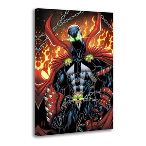 May include: Comic book art print of the character Spawn. The image depicts Spawn in a black suit with a red cape, chains, and skull details. The background is a fiery orange and yellow.