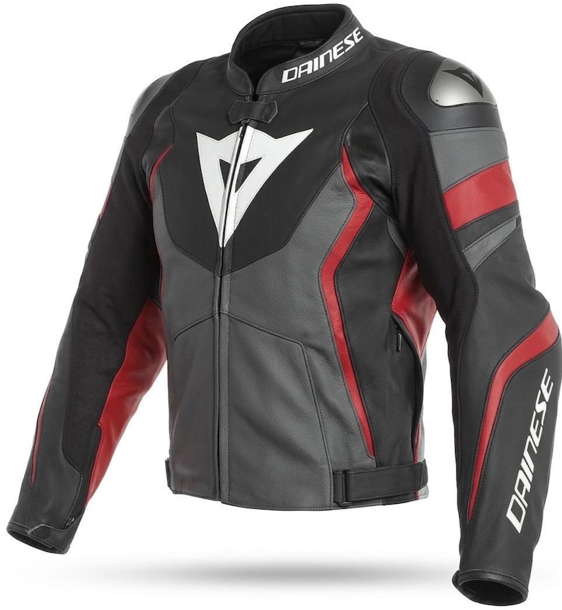 May include: Black, gray, and red leather motorcycle jacket with the brand name "DAINESE" printed on the collar and sleeve. The jacket features a white logo on the chest and red accents on the sleeves and sides.