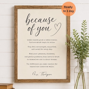 May include: A framed print with the words "because of you" in elegant script, accompanied by a heart symbol. The print includes a heartfelt message and is ready in one day. The frame is a warm brown color.