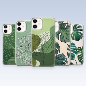 May include: A collection of five phone cases featuring various green Monstera leaf designs. The cases showcase different artistic styles, including line art, abstract shapes, and detailed leaf illustrations, all set against a light background.