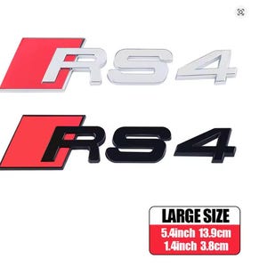 May include: Two RS4 car emblem sets. One set is silver with a red background, the other is black with a red background. The size is 13.9cm by 3.8cm.