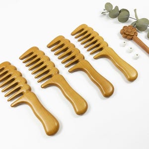 May include: A rustic wooden sign with the text "Welcome to our home" in white lettering. The sign features a distressed finish and a simple, inviting design, perfect for a front porch or entryway.