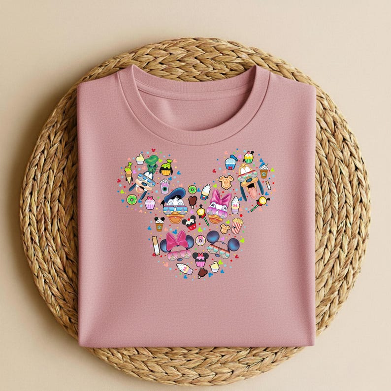 May include: A white ceramic mug with a black handle and the text "But First, Coffee" in a handwritten style. The mug is on a white surface. The mug is approximately 10 cm tall.