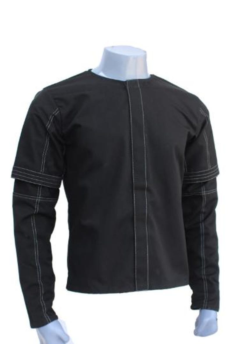 May include: Black long-sleeve shirt with white stitching details. The shirt features a round neck and a vertical seam down the front. The sleeves have a unique design with a layered look, and the stitching is visible.