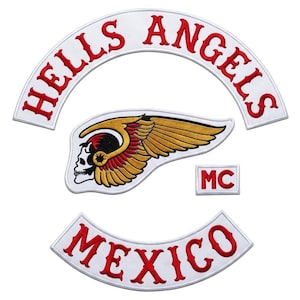 May include: Embroidered patches featuring the words "HELLS ANGELS" and "MEXICO" in red on white arched backgrounds. A skull with wings and the letters "MC" are also included.