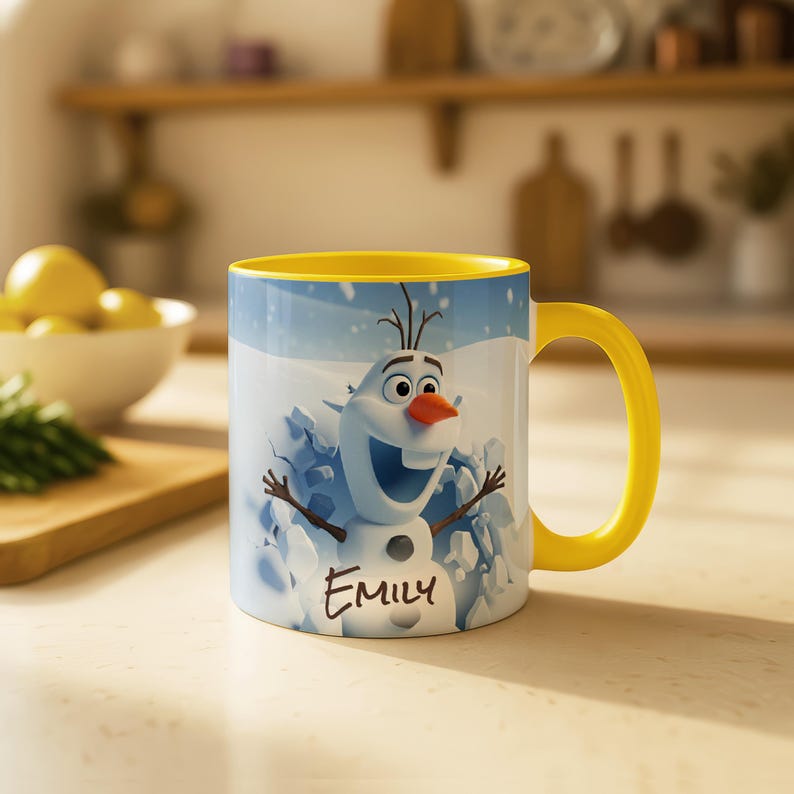 May include: A white ceramic mug with a yellow handle and interior. The mug features a cartoon image of Olaf from Frozen, with the name "Emily" printed below. The background shows a snowy scene.