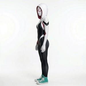 May include: A black and white superhero costume with a hooded cowl, featuring red accents and a spider-web design. The costume includes a full-body suit and teal sneakers. The overall design is sleek and form-fitting.