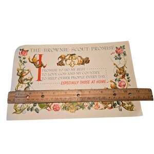 May include: Vintage Brownie Scout Promise print with illustrations of elves and floral accents. The text reads "Promise to do my best...to love God and my country...to help other people every day...especially those at home."
