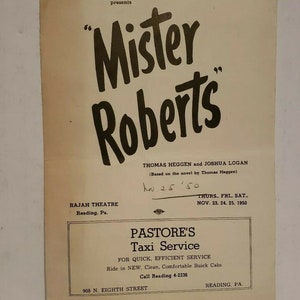 May include: A black and white poster advertising a play called "Mister Roberts" starring Thomas Heggen and Joshua Logan. The play is based on the novel by Thomas Heggen. The poster also includes information about the Rajah Theatre in Reading, Pennsylvania, where the play is being performed. The play is scheduled to run from November 23rd to 25th, 1950.