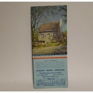 May include: Vintage calendar featuring a color illustration of Grant's birthplace in Point Pleasant, Ohio. The image shows a small house with a wooden fence and a cannon. The calendar includes the month of April 1942.