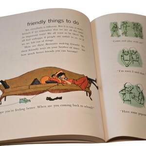 May include: An open book with illustrations and text. The left page features a drawing of two people on a couch, with the text "friendly things to do." The right page has drawings of children playing and the text "Come and play with us."
