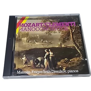 May include: A CD case featuring the album "Mozart/Clementi Piano Concertos." The cover art depicts a classical painting of people near a body of water. The text includes the names "Malcolm Frager/Ivan Drenikov, pianos."