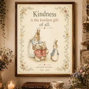 May include: A framed wall art print featuring a vintage-style illustration of rabbits from Beatrix Potter. The text reads, Kindness is the loveliest gift of all. The artwork is surrounded by a delicate floral border on a cream-colored background.