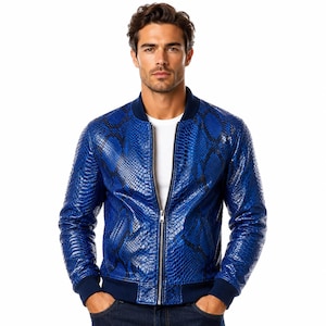 May include: A vibrant blue bomber jacket with a snakeskin pattern. The jacket features a ribbed collar, cuffs, and hem, and a silver zipper closure. The jacket is a bold fashion statement.