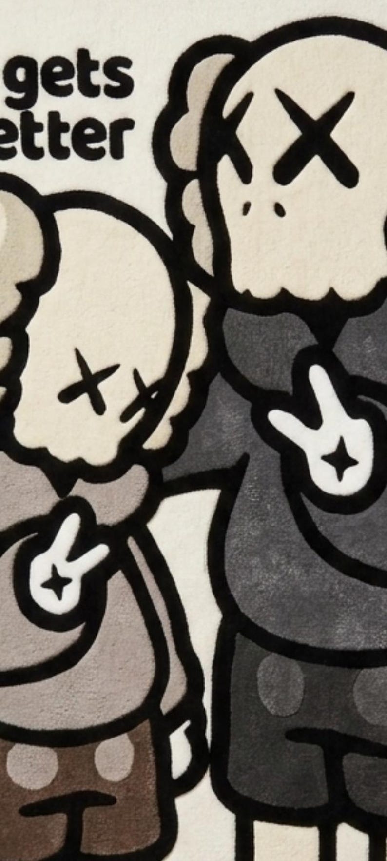 May include: A tufted rug featuring two cartoon-style figures with X-shaped eyes, wearing hoodies and making peace signs with their hands. The figures are rendered in shades of beige, gray, and black, with the partial text "gets etter" visible.