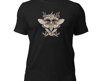 May include: Black t-shirt with a graphic of a moth with intricate details and floral accents.