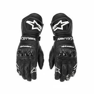 May include: Pair of black motorcycle gloves with white accents and the word "PRO" printed on the wrist. The gloves feature a star logo and the brand name "Alpinestars". The gloves have protective padding on the knuckles and fingers.