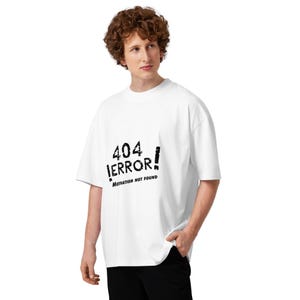 May include: White oversized t-shirt with the text "404 ERROR!" in black, with the phrase "Motivation NOT found" below. The shirt is a casual style.
