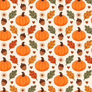 May include: A repeating pattern on a cream background featuring orange pumpkins, brown acorns, small white flowers, and autumn leaves in shades of green, orange, and red, interspersed with tiny dark red hearts throughout the design.