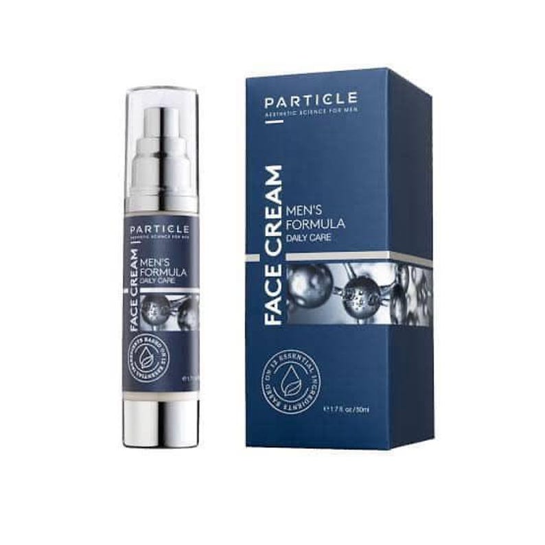 May include: A skincare product for men, featuring a pump bottle and a box. The bottle and box are navy blue with white text that reads "Particle Men's Formula Face Cream". The box also has the text "Aesthetic Science for Men".