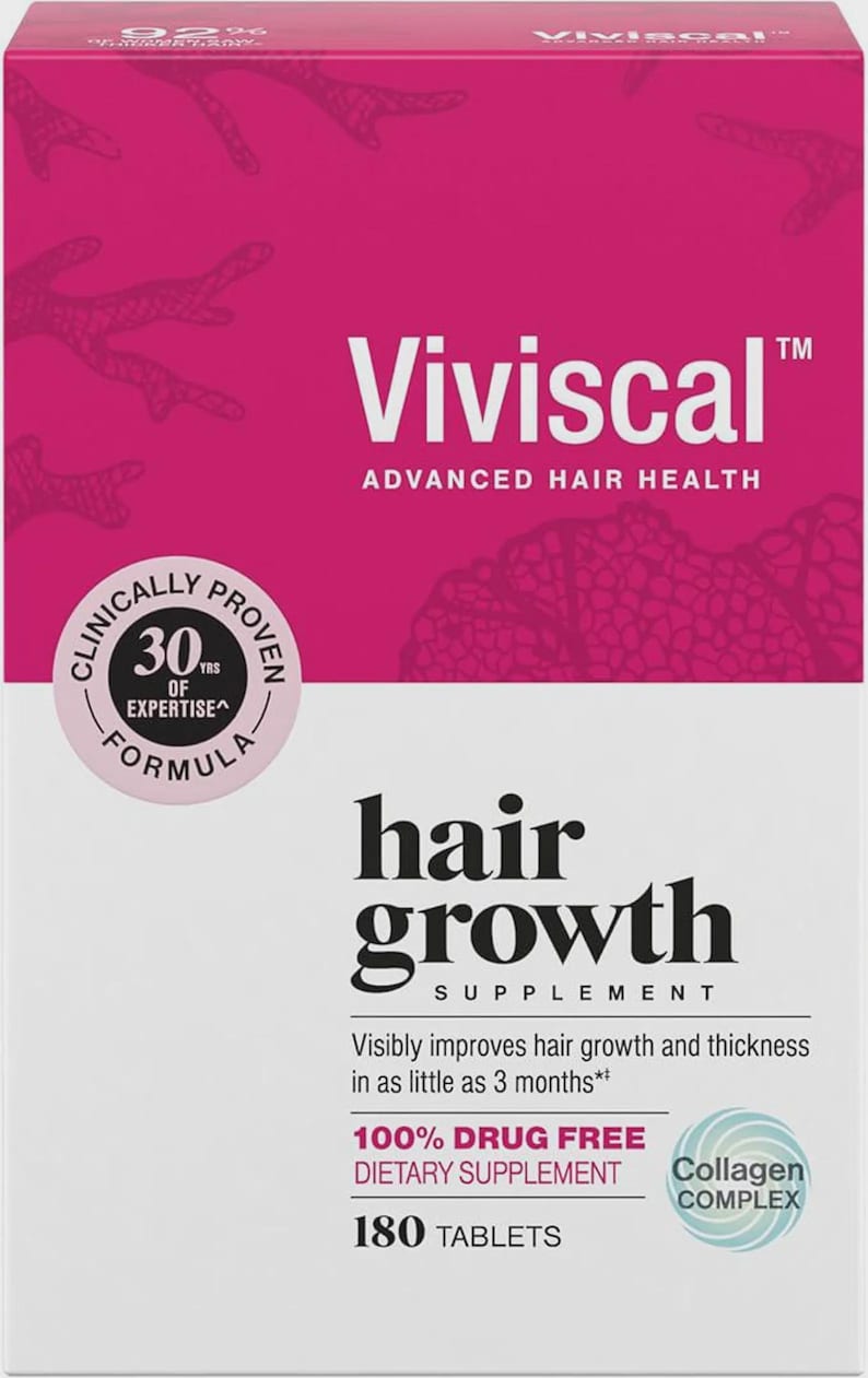 Puede incluir: Una caja blanca y rosa de suplemento para el crecimiento del cabello Viviscal. La caja presenta el logotipo de Viviscal, las palabras "Advanced Hair Health" y el texto "hair growth supplement". Tambi&eacute;n indica que el producto es 100% libre de drogas y contiene 180 comprimidos.