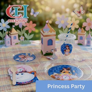 May include: A princess-themed party setup with a pink and gold castle-shaped box, clear plates, a cup with a straw, and a coaster. The plates and cup feature princess illustrations. The scene is decorated with paper flowers and butterflies.