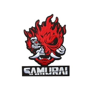 May include: A white ceramic mug with a black handle and the text "But First, Coffee" in a handwritten style. The mug is on a white surface. The mug is approximately 4 inches tall.