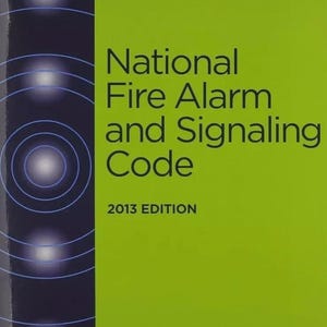 May include: A lime green book cover titled National Fire Alarm and Signaling Code 2013 Edition. The top right corner features NFPA 72 in a dark gray box. The left side has a dark blue vertical strip with white circular wave patterns.