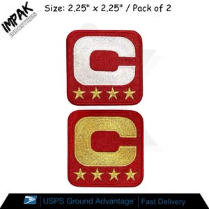 May include: Two red embroidered patches, each 2.25 inches square, featuring a capital "C" and four stars. One patch has a white "C", the other a gold "C". The text "IMPAK INDUSTRIES" is in the upper left corner. The text "Size: 2.25" x 2.25" / Pack of 2" is above the patches.