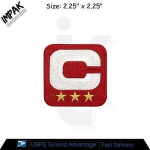 May include: A red and white embroidered patch, measuring 2.25 inches by 2.25 inches, features a white letter "C" and three gold stars. The patch is square with rounded corners. The brand name "IMPAK INDUSTRIES" is visible.