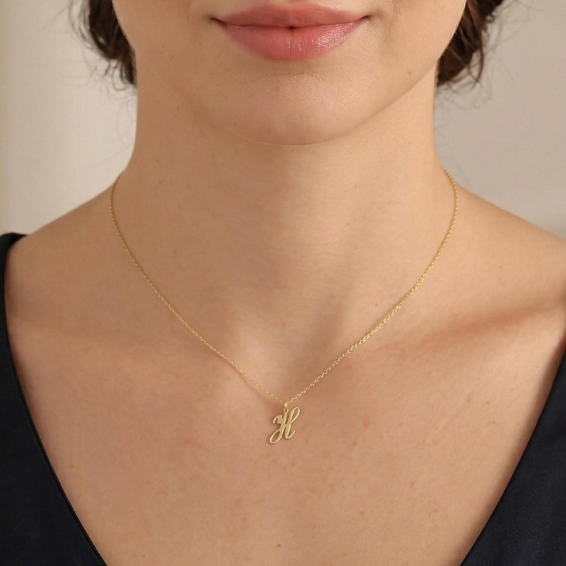 May include: A white ceramic mug with a black handle and the text "But First, Coffee" in a bold, black font. The mug is set against a blurred background, suggesting a cozy setting.Custom Cursive Initial Necklace, Gold Minimalist Letter Charm Necklace, Silver Alphabet Pendant Necklace, Personalized Jewelry, Gift for Her