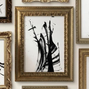 May include: A collection of framed abstract art pieces. Each piece features bold black brushstrokes on a white background. The frames are ornate and gold-colored, creating a gallery wall aesthetic. The artwork is modern and minimalist.