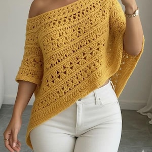 May include: Mustard yellow crochet top with an off-the-shoulder design. The top features a detailed openwork pattern with floral and geometric shapes. The sleeves are short, and the overall style is casual and bohemian.