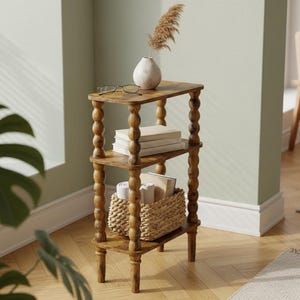 May include: A three-tiered wooden side table with turned legs and a warm brown finish. The top shelf holds a white vase with dried flowers and eyeglasses. The middle shelf has books, and the bottom shelf has a woven basket.