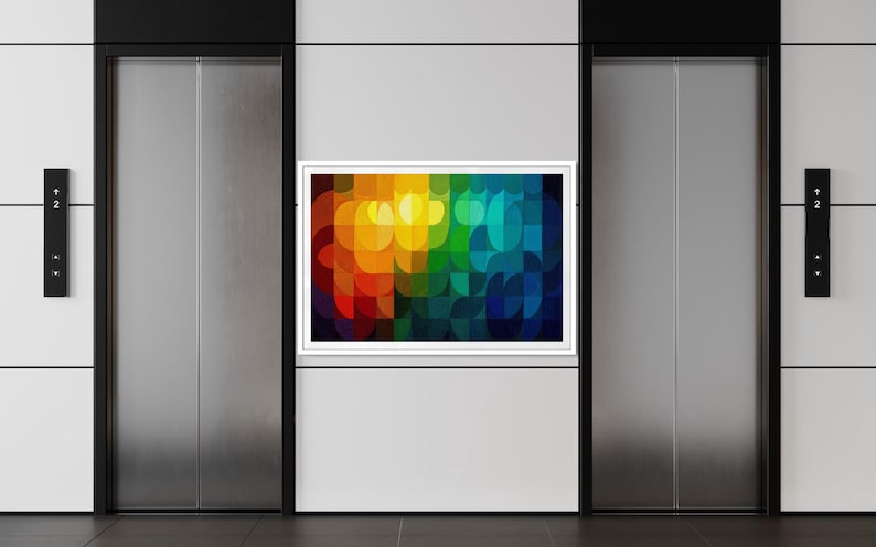 May include: A modern interior featuring two elevator doors with a colorful abstract art piece in a white frame. The artwork displays a vibrant spectrum of colors, including red, orange, yellow, green, and blue.