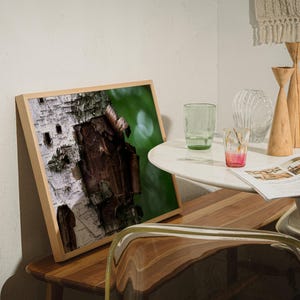 May include: A white ceramic mug with a black handle and the text "But First, Coffee" in a bold, black font. The mug is set against a neutral background, highlighting its simple design.