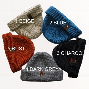 four different colors of beanies are shown in a circle