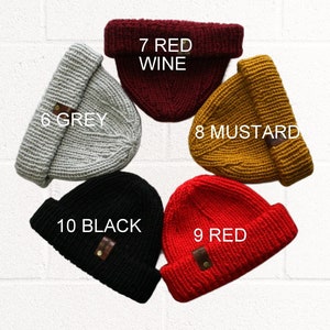 a set of five beanies with different colors and sizes