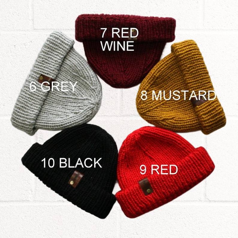 a set of five beanies with different colors and sizes