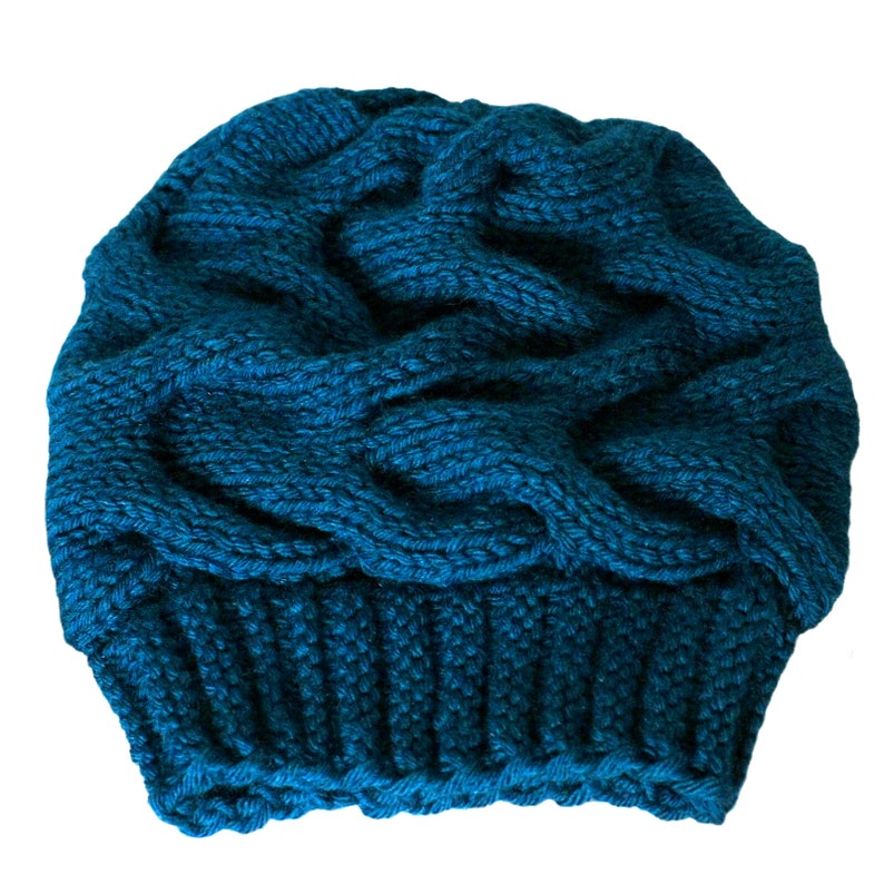 a blue knitted hat on a white background
